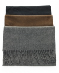 Add a touch of polish to your outerwear with this wear-everywhere solid fringe scarf from John Ashford.