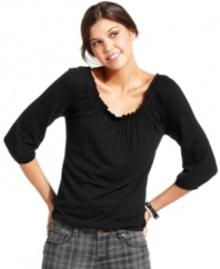 A ruffled neckline adds adorable style to this every day top from Belle Du Jour!