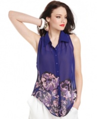 GUESS? goes bold in color and design, equipping a richly-hued blouse with floral print and a novel, asymmetrical hem!
