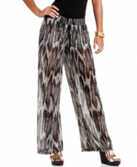 Slide into the fiercest pants of the season! GUESS? combines snakeskin print chiffon with a voluminous silhouette -- and creates a pair of palazzo pants that's illusion-style du jour!