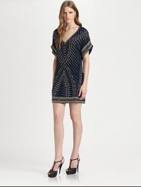 Constructed with luminous beads that form a tribal pattern, this silk v-neck dress has dropped shoulders, short dolman sleeves and a short silhouette. V-neckDropped shouldersShort dolman sleevesAbout 18 from natural waistBeaded silkDry cleanImportedModel shown is 5'10 (177cm) wearing US size Small.