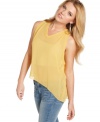 Sheer and asymmetrical, this top from GUESS? strikes a chic cord by combining two of the season's most trend-right details!