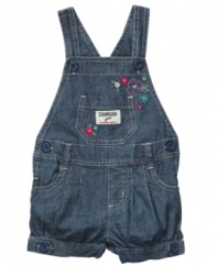 Cool country classic. Overalls get a cute, modern makeover with button details, a cinched leg and pretty flower embroidery on these sweet shortalls from Osh Kosh.