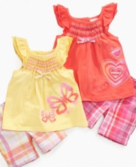 Color her world brightly with one of these fun smocked tunic and bermuda short sets from Nannette.
