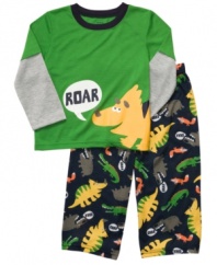 Send him off to have a roaring good time in his dreams in this fun dinosaur shirt and pant sleepwear set from Carter's.