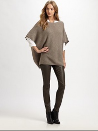 Wool and cashmere boatneck infused with traditional poncho sleeves and a length that hits below the hips. BoatneckPoncho sleevesLonger length hits below the hips70% wool/30% cashmereDry cleanImportedModel shown is 5'10 (177cm) wearing US size Small.