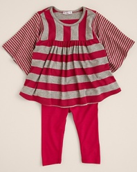 A voluminous tunic featuring oversized flutter sleeves and an a-line body, rendered by Little Ella in brightly hued mixed stripes.