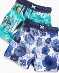 Dip your toes in. He'll be ready to get wet with a pair of these fun graphic print swim trunks from Mick Mack.