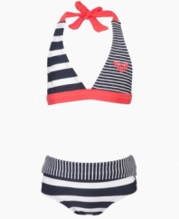 Surfer style. This two-piece swimsuit from Roxy mixes up the patterns for a summer beach look that will be a hit.