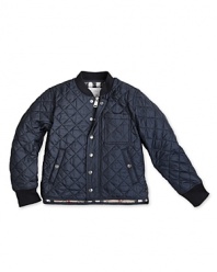 This woodsy quilted jacket features a touch of Burberry's signature check at the collar and lining.