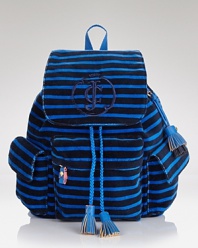 A stylish way to strut back to school, this striped velour backpack has Juicy Couture's signature accents, like the large embroidered crown logo on the front, tasseled drawstring closure and cute spotted lining.
