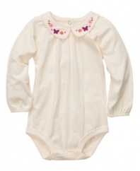 She'll look angelic in this dainty, Peter Pan collared bodysuit from Osh Kosh.