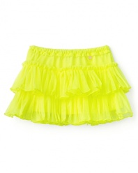 The ultra-light mesh tutu from Juicy Couture easily adds a splash of color and movement to her look.