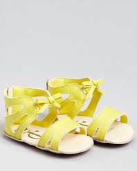We love the light look of these cute cut-out sandals, adorned at the ankle with an elastic bow.