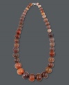 Light your look on fire! Avalonia Road's hot orange fire agate necklace (138-1/3 ct. t.w.) features a graduated design that highlights the neckline. Clasp crafted in sterling silver. Approximate length: 21 inches.