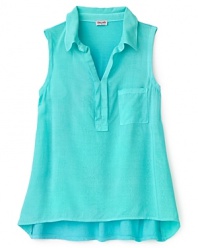 Sleeveless polo with a flowing high/low hem and ruffle detail at the placket.