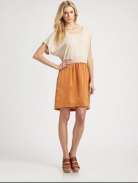 Wool-blend scoopneck with short dolman sleeves has an attached silk skirt with slash pockets and a hi-low hem. Ribbed scoopneckDropped shouldersShort dolman sleevesAttached silk skirt with slash pocketsHi-low hemAbout 22 from natural waist35% wool/32% nylon/30% viscose/3% cashmereDry cleanMade in USA of imported fabricModel shown is 5'10 (177cm) wearing US size Small.