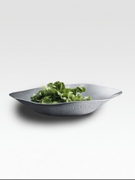 Mirror-polished stainless steel's mercury-like surface lends a fluid finish to this elegant, occasional bowl. From the Liquid CollectionStainless steel3¾H X 15½ diam.Dishwasher safeImported