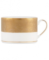 Make any occasion memorable with Gold Dust dinnerware. Combining the urbane style of Donna Karan with the renowned craftsmanship of Lenox, this timeless bone china cup radiates luxury with a wide band of matte-textured gold.