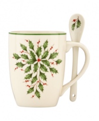 Rich details to make even hot cocoa more inviting. Part of an exquisite china holiday dinnerware and dishes collection from Lenox, this cocoa mug and spoon set features a lavish holly motif painted on soft ivory.