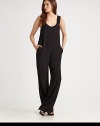Trend-forward jumpsuit fashioned with a plunging scoopneck, slash pockets and an unexpected scoopback. Plunging scoopneckWide strapsSlash pocketsLow scoopbackInseam, about 35ViscoseDry cleanImported of Italian fabricModel shown is 5'11 (180cm) wearing US size Small.