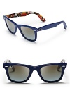 Your inner rock star will appreciate the hidden guitar print on the interior of these Ray-Ban Wayfarer sunglasses; true blue frames top off all your denim looks.