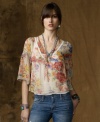 Delicate lace and an earthy floral watercolor pattern create a whisper of vintage romance on Denim & Supply Ralph Lauren's crinkled chiffon butterfly blouse, perfect for pairing with edgier pieces for a look that defines modern femininity.