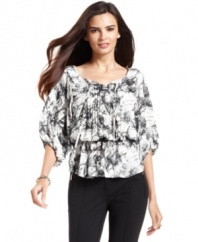 Alfani's peasant top is sophisticated with a brushstroke print and pleated placket.