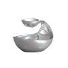 Ideal for intimate gatherings and small surfaces, the exquisite Mini Scoop Server is a graceful blend of form and function that keeps hors d'oeuvre pairings together. Use it for nuts and olives, dips and chips, chocolate medleys, and more.