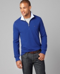 Perfect for a relaxing night out, this half-zip Tommy Hilfiger shirt adds suave style to any outfit.