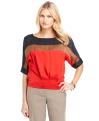 This Ellen Tracy blouse is modern and retro at once. Colorblocked panels make a stylish statement, while the easy silhouette and pleated waistband lend a fashion-forward shape to this chic must-have!