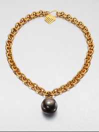 A large gunmetal-finished sphere on an 18k goldplated link chain. Brass18k goldplated brassLength, about 20Pendant size, about 1Hook closureMade in USA 
