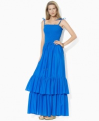 Rendered in airy cotton voile for a full, floaty silhouette, Lauren by Ralph Lauren's graceful maxi dress is designed with a flattering smocked bodice and a two-tiered ruffled hem for whimsical appeal.
