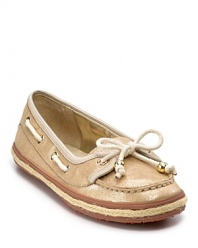 The boat shoe blends seamlessly with the ballet flat in this charming lace-trimmed shoe from KORS Michael Kors.