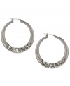 A dash of dazzle. Crystal accents add just the right amount of subtle sparkle to Kenneth Cole New York's hoop earrings. Crafted in hematite tone mixed metal, they'll be a casually chic component of your jewelry collection. Approximate diameter: 1-5/8 inches.