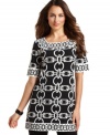 In a graphic black and white, this Alfani chain-printed tunic is perfect for adding a pop of bold print to your ensemble!