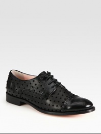 Classically styled leather oxford fashioned with velour polka dots and patent leather trim. Stacked heel, 1 (25mm)Leather, patent leather and velour upperLeather lining and solePadded insoleMade in Italy