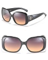 Elegant cat eye sunglasses with signature button logo at temples for the ultimate Tory Burch look.