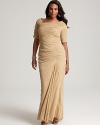 An elegant short-sleeved silhouette lends flattering appeal to this red carpet-worthy gown from Tadashi Shoji Plus.