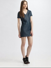 Backed by soft cotton paneling, this trend-forward leather dress has a v-neck, slash pockets and ultra-short silhouette. V-neckShort sleevesSlash pocketsInvisible back zipperAbout 18 from natural waistFront: Leather; Back: CottonDry clean with leather specialistImportedModel shown is 5'10 (177cm) wearing US size 2.
