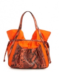 A casual nylon silhouette accented with a bold snakeskin print. This fierce drawstring bag from FALCHI by Falchi features a roomy interior for holding all your chic necessities, and so much more.