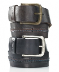 Add a hefty dose of rugged vintage style to your favorite jeans combo with the sleek center stitching and antiqued metal buckle of this leather harness belt from GUESS.