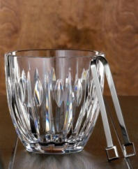 Modern cuts on timeless crystal give this ice bucket a dramatic appeal. Perfect when making drinks on the rocks or for chilling wine or champagne. Includes a pair of stainless steel tongs.