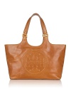 Express your Tory Burch style with this luxe bombe glazed leather tote. The bestselling style is crafted in a chic oversized silhouette and embossed with her signature logo.