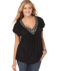 A beaded neckline glams up the short sleeve plus size top by Soprano.