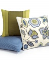 A mixture of embroidery and applique details create a modern floral design in this Martha Stewart Collection decorative pillow all in bright green and blue hues on a soft ground.