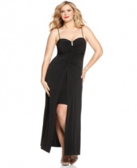 This sexy plus size evening gown by Onyx is outfitted with a fitted, ruched bodice that splits at the waist to reveal a thigh-high inner hemline, while the overlay falls elegant to the floor.