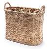 A basket in tightly braided water hyacinth brings a rustic, earthy look to your allover décor.