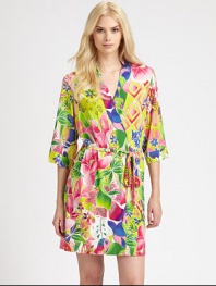 Eye-popping florals in vibrant hues cover this silky-smooth wrap. V-neckThree-quarter length sleevesSelf-tie waistAbout 35 from shoulder to hem92% polyester/8% spandexMachine washImported