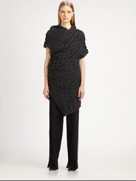 Soft, chunky knit cables, offset by a modern, asymmetrical silhouette.High necklineAsymmetrical front zipShort sleevesAsymmetrical hemlineAbout 25 from natural waist68% alpaca/22% nylon/10% woolDry cleanMade in Italy of imported fabricModel shown is 5'9½ (176cm) wearing US size Small. 